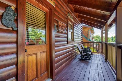 A Stone's Throw covered entry deck with rocking chairs