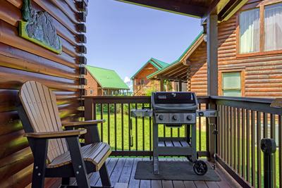 A Stone's Throw covered back deck with gas grill