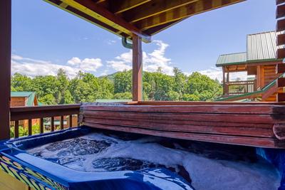 A Stone's Throw covered back deck with hot tub