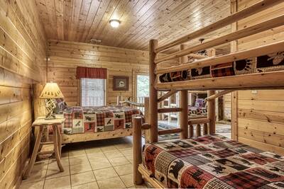Rainbows End lower level area with king size beds and bunk beds