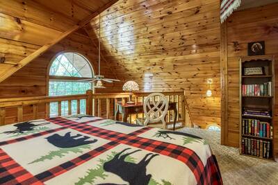 Campfire Lodge upper level loft area with queen size bed