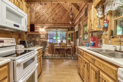 Striking in the Smokies fully furnished kitchen and dining area