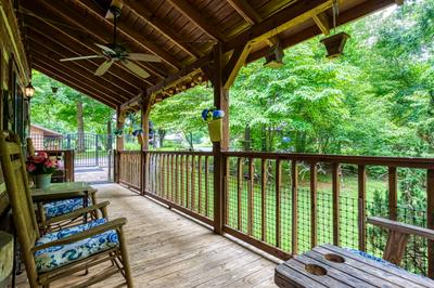 Striking in the Smokies covered entry deck with rocking chairs