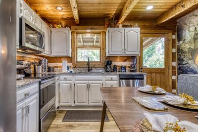 Secluded Summit fully furnished kitchen with stainless steel appliances