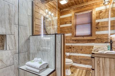 Secluded Summit bathroom with a walk in tile shower