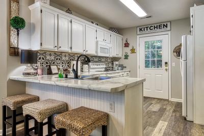 Sparkling Waters bar top and fully furnished kitchen 