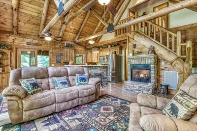 Blue Sky living room with stone encased gas fireplace