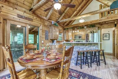 Blue Sky dining table, bar top, and fully furnished kitchen