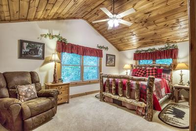 Blue Sky upper level bedroom with queen size bed and recliner