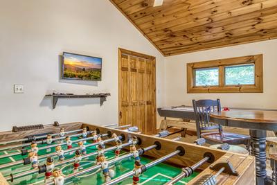 Blue Sky upper level game room with foosball table