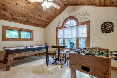 Blue Sky upper level game room with air hockey table