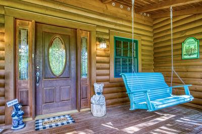 Blue Sky covered front deck with swing