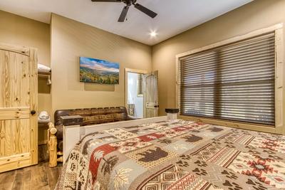 The Lodge at Burg Hill main level bedroom with king size bed and futon