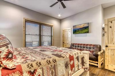 The Lodge at Burg Hill main level bedroom three with king bed and futon