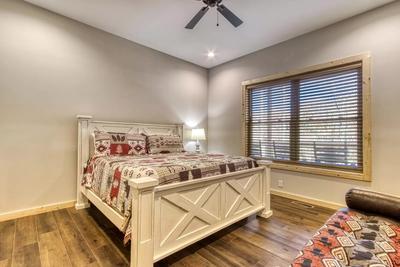 The Lodge at Burg Hill main level bedroom three with a king bed