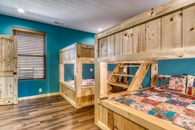 The Lodge at Burg Hill upper level bedroom with two sets of queen over queen bunk beds