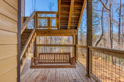 The Lodge at Burg Hill covered deck with outdoor swing