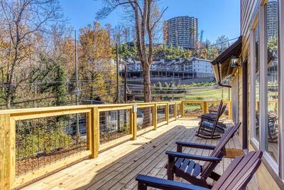 The Lodge at Burg Hill open back deck with Adirondack chairs and rocking chairs