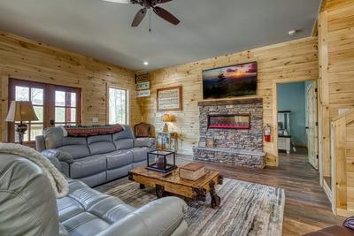 The Manor at Burg Hill living room with year round stone encased electric fireplace