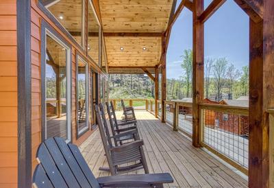 The Manor at Burg Hill covered deck with rocking chairs