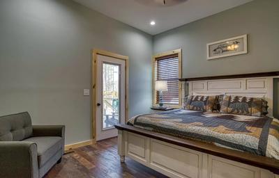 The Manor at Burg Hill main level bedroom with king size bed