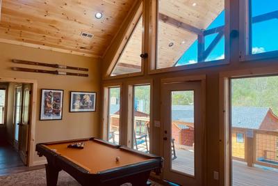 The Manor at Burg Hill upper level game room with vaulted ceilings 