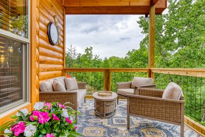 Midnight Bowling main level deck with cushioned outdoor furniture