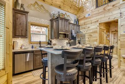 Midnight Bowling kitchen island with bar stools