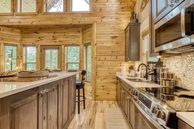 Midnight Bowling fully furnished kitchen with granite countertops and stainless steel appliances