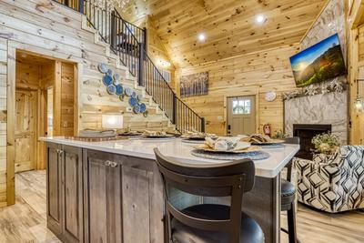 Midnight Bowling kitchen island, living room, and loft area