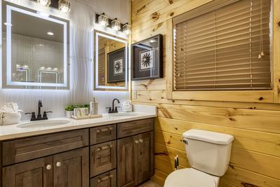 Midnight Bowling main level bathroom with double vanities with heated mirrors