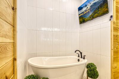 Midnight Bowling lower level bathroom with soaking tub and 50 inch TV