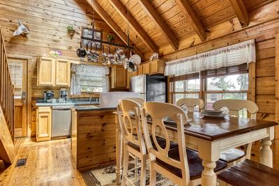Lazy Man's Way dining area and fully furnished kitchen 