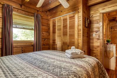 Lazy Man's Way main level bedroom one with queen size bed