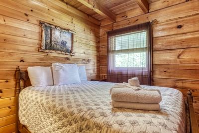 Lazy Man's Way main level bedroom with full size bed