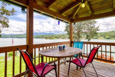 Lazy Man's Way covered wrap around deck with table and chairs
