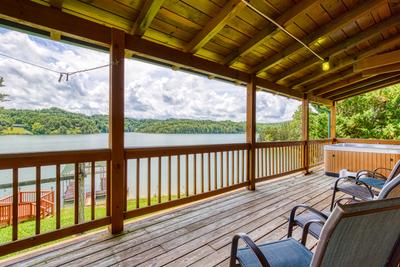 Lazy Man's Way covered back deck overlooking Douglas Lake