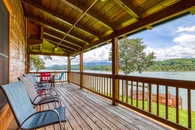 Lazy Man's Way covered wrap around deck overlooking Douglas Lake