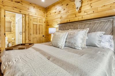 Midnight Bowling main level bedroom with king size bed and private bathroom