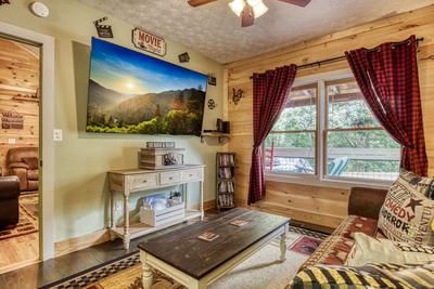 Sweet Tennessee Charm theater room with 75 inch TV