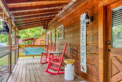 Sweet Tennessee Charm covered entry deck with swing