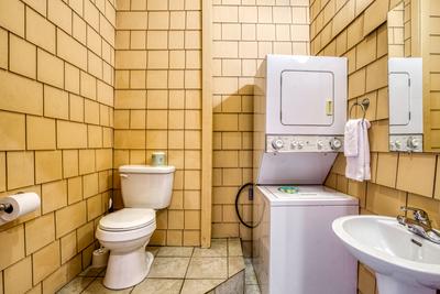 Wet and Wild lower level half bath with washer and dryer