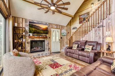 Heavenly Gaze living room with year round electric fireplace