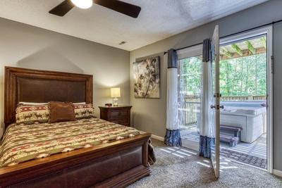Feathers and Fur lower level bedroom with queen size bed and deck access