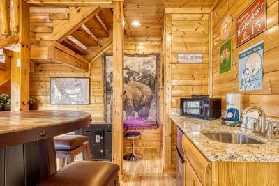 Awesome Views kitchen lower level game room with kitchenette and cocktail style arcade game