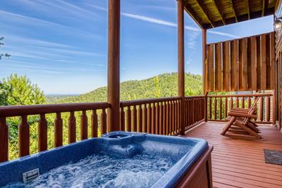 Wet and Wild covered back deck with hot tub and mountain views