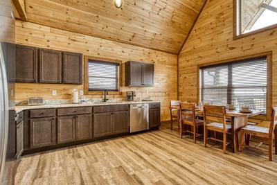 View to a Thrill fully furnished kitchen and dining area