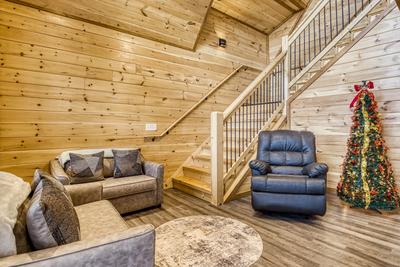 View to a Thrill living room with a recliner and two love seats