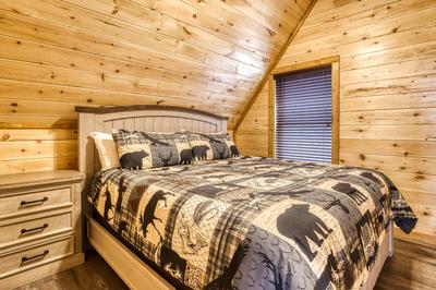 View to a Thrill upper level bedroom with a king size bed