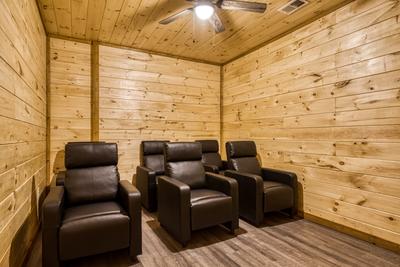 View to a Thrill lower level theater room with six recliners